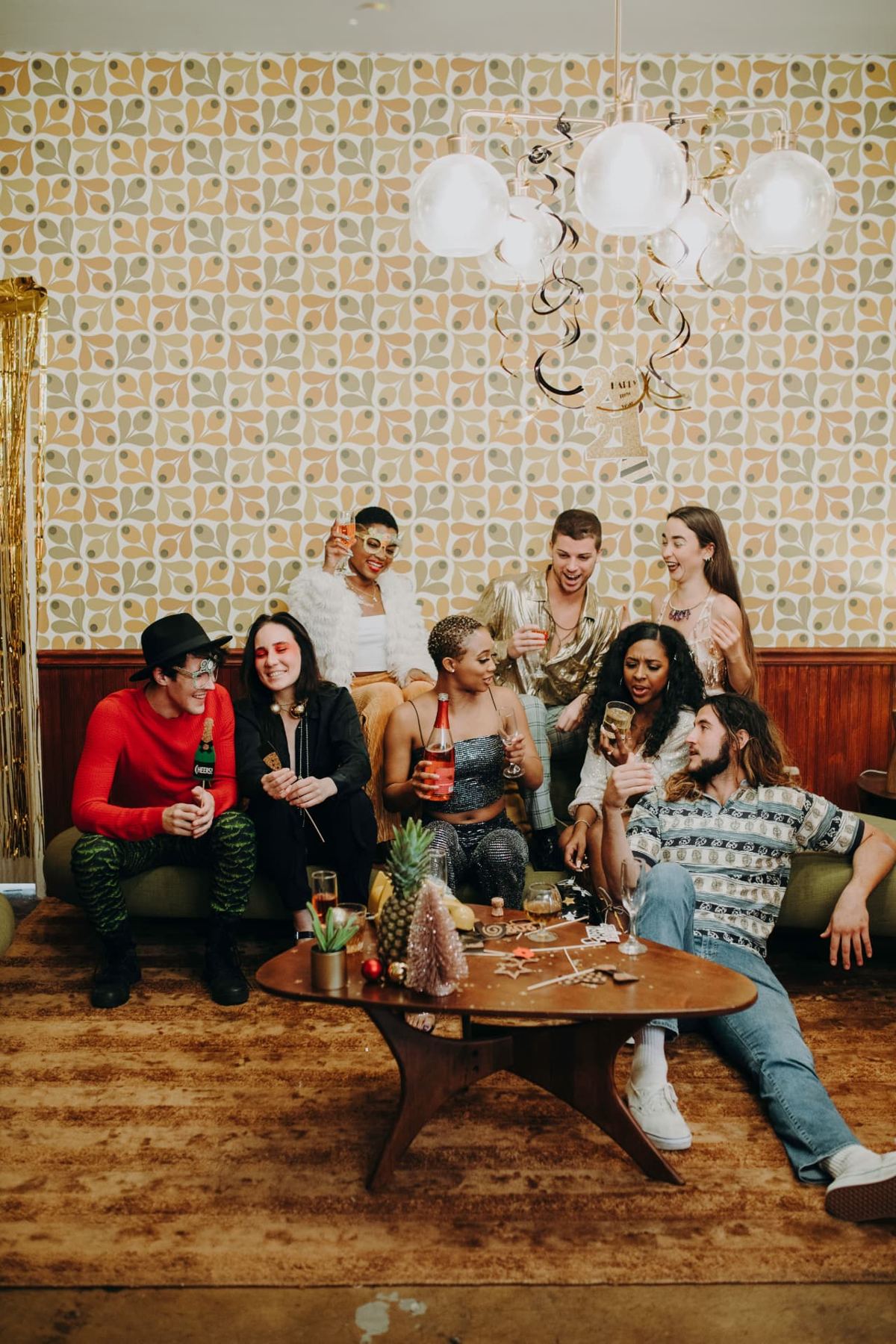 Friends laughing together at a house party